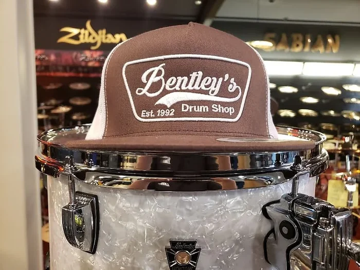 Bentley’s Drum Shop Trucker Snapback Hat in Brown and White